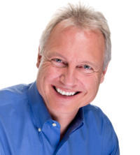 White male in blue shirt smiling 